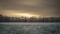 Long exposure of clouds over a field in wintertime in Munsterland, Germany Royalty Free Stock Photo