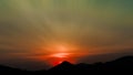 Long exposure colorful sunset over the mountains. Dramatic tropical mountain forest and orange sky sunset. Spectacular sunrise sky Royalty Free Stock Photo