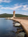 Long exposure day photo of Lighthouse in Macinaggio marina Corsica, France, Europe Royalty Free Stock Photo