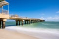 Long exposure daytime photo fishing pier blurry waves