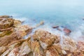 Long exposure of dreamy seascape and rocky beach Royalty Free Stock Photo