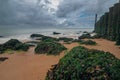 Long exposure of the Dutch coastline with the water breakers during low tide of the North sea with a dramatic sky Royalty Free Stock Photo