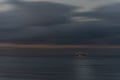 Long exposure of early morning shrimping boat heading out to sea Royalty Free Stock Photo