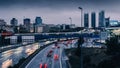 Long exposure of heavy commuter highway traffic looking towards the Cuatro Torres Business district in Madrid, Spain.