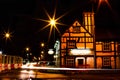 Long exposure of a house view and car lights leaving glow on a road at night in Newark on Trent, UK Royalty Free Stock Photo