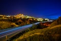 Mountains and cities at Cappadocia, Turkey at twilight, blue skies and bright orange city lights. Royalty Free Stock Photo