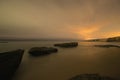 Long exposure image of coastal rocks on ocean beach Royalty Free Stock Photo