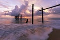 Long exposure image of Dramatic sky seascape with Old wooden pole in the sea sunset or sunrise scenery background Royalty Free Stock Photo