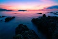 Long exposure image of Dramatic sky seascape with rock in the foreground sunset scenery view Beautiful light nature background Royalty Free Stock Photo