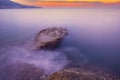 Long exposure image of Dramatic sky seascape with rock in sunset or sunrise sky scenery background. Amazing light nature landscape Royalty Free Stock Photo