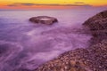 Long exposure image of Dramatic sky seascape with rock in sunset or sunrise sky scenery background. Amazing light nature landscape Royalty Free Stock Photo
