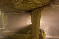 Light beams cutting through the damp underground haze, Hanibe caves, Japan. Royalty Free Stock Photo