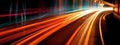 A long-exposure image of light trails from moving vehicles at night, creating a sense of motion and excitement. Web banner