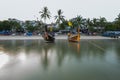 Long exposure image of long tail boats moored