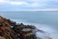 Long exposure image of a rocky beach in Anilao