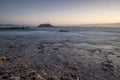 Long exposure of a lava beach. Sandy beach in the morning. Bay, coast, Corralejo, Las Palmas Province, Spain Royalty Free Stock Photo