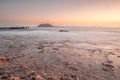 Long exposure of a lava beach. Sandy beach in the morning. Bay, coast, Corralejo, Las Palmas Province, Spain Royalty Free Stock Photo