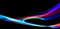 Long exposure, light painting photography. Vibrant streaks of neon color against a black background Royalty Free Stock Photo