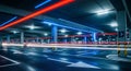 Long exposure of light trails in a modern multi-level parking garage at night image photo Royalty Free Stock Photo