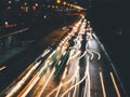 Long exposure light trails on the street at night, motion speed traffic light with blurred traces from cars on road Royalty Free Stock Photo