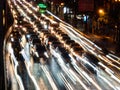 Long exposure light trails on the street at night, motion speed traffic light with blurred traces from cars on road Royalty Free Stock Photo