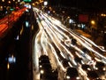 Long exposure light trails on the street at night, motion speed traffic light with blurred traces from cars on road Royalty Free Stock Photo