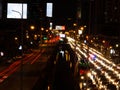 Long exposure light trails on the street at night, motion speed traffic light with blurred traces from cars on road Royalty Free Stock Photo