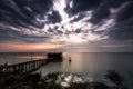 Long exposure of magic sunrise over the ocean with a hut in the Royalty Free Stock Photo