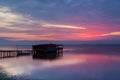 Long exposure of magic sunrise over the ocean with a hut in the Royalty Free Stock Photo