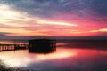 Long exposure of magic sunrise over the ocean with a hut in the Royalty Free Stock Photo