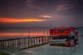 Long exposure of magic sunrise over the ocean with a hut in the Royalty Free Stock Photo