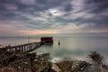 Long exposure of magic sunrise and a wooden hut. Royalty Free Stock Photo