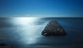 Long exposure, dreamlike view of causeway, cut off by the tide, Torrox Costa, Spain.