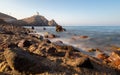 The rocky coast and the lighthouse at Cabo de Gata. Royalty Free Stock Photo
