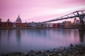 Long exposure, Millennium bridge and St Paul`s cathedral at sunset in London Royalty Free Stock Photo