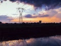 Long exposure of moving water and clouds at sunset overlooking the Naviglio Pavese, Italy. The canal links the city of Milan and P Royalty Free Stock Photo