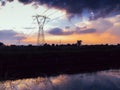 Long exposure of moving water and clouds at sunset overlooking the Naviglio Pavese, Italy. The canal links the city of Milan and P Royalty Free Stock Photo