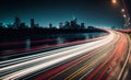 Long exposure of night city. Car motion trails on road. Speed light streaks background with blurred Royalty Free Stock Photo