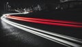 Long exposure of night city. Car motion trails on road. Speed light streaks background with blurred fast moving light effect Royalty Free Stock Photo