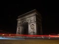 Long exposure night panorama light trails traffic lights at Arc de Triomphe Etoile monument Champs Elysees Paris France
