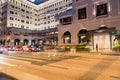 Long exposure night scene pedestrian crossing with blurred people waiting