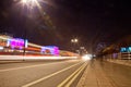 Night time semi-abstract of traffic light trails on a modern concrete bridge Royalty Free Stock Photo