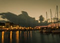 Long exposure old harbor view boats sky car lights Royalty Free Stock Photo