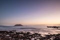 Long exposure of a lava beach. Sandy beach in the morning. Bay, coast, Corralejo, Las Palmas Province, Spain Royalty Free Stock Photo