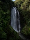 Long exposure panorama of tropical lush green protected forest waterfall cascade Peguche in Otavalo Imbabura Ecuador Royalty Free Stock Photo