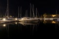 Long-exposure photo at a harbor, featuring a captivating view of boats and a beautiful reflection