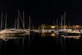 Long-exposure photo at a harbor, featuring a captivating view of boats and a beautiful reflection