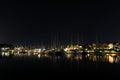 Long-exposure photo at a harbor, featuring a captivating view of boats and a beautiful reflection