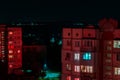 Long exposure photo of high-rise buildings in red and blue lights. Night cityscape. Big city life Royalty Free Stock Photo