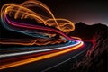 a long exposure photo of a highway with light streaks on it\'s side and a mountain in the background Royalty Free Stock Photo